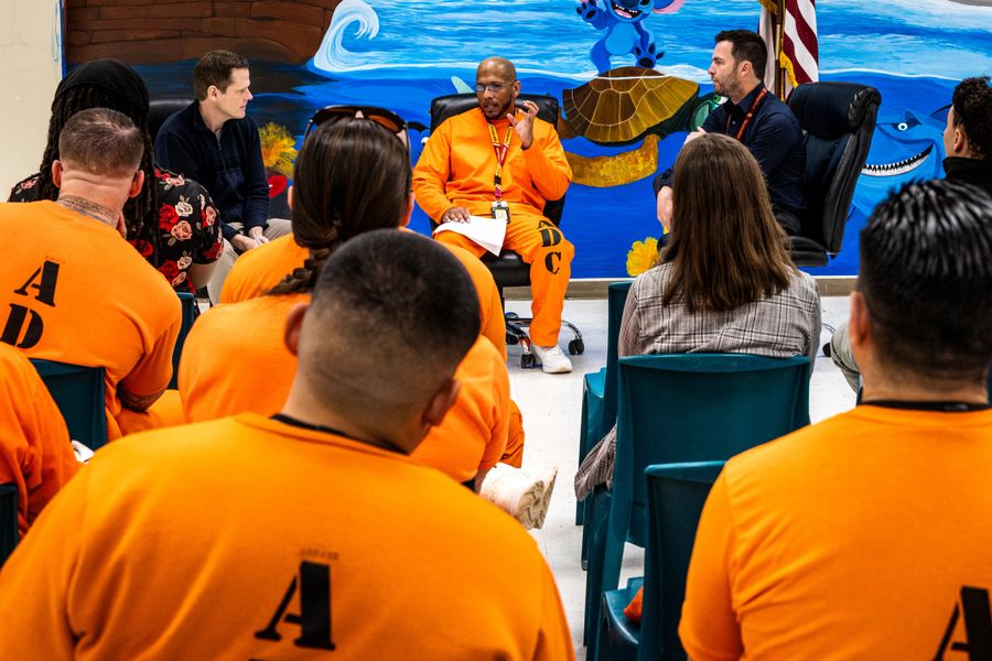 Men in a prison classroom setting